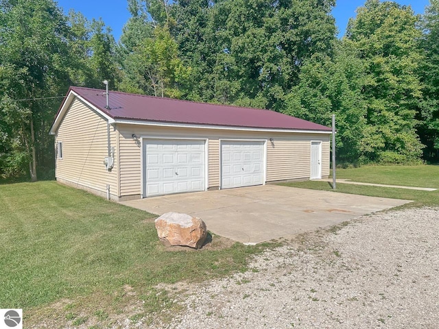 garage featuring a yard