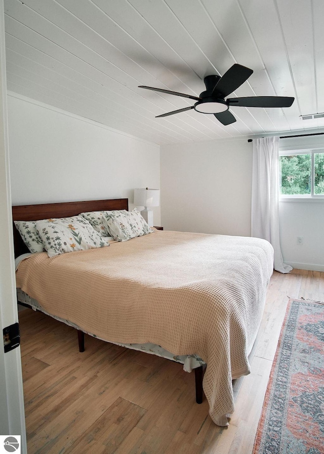 bedroom featuring hardwood / wood-style flooring and ceiling fan