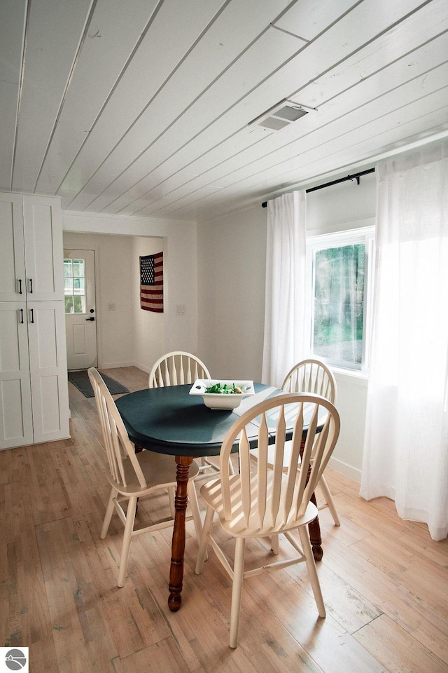 dining space with light wood-type flooring