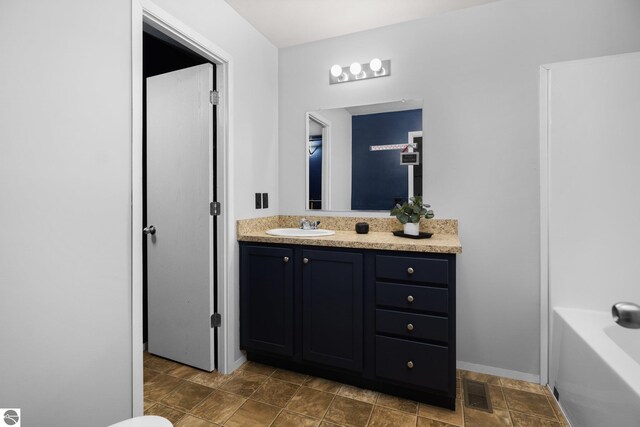 full bathroom with vanity, toilet, and tub / shower combination