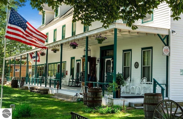 exterior space with a yard and covered porch