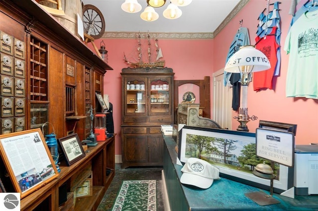 interior space featuring a chandelier and ornamental molding