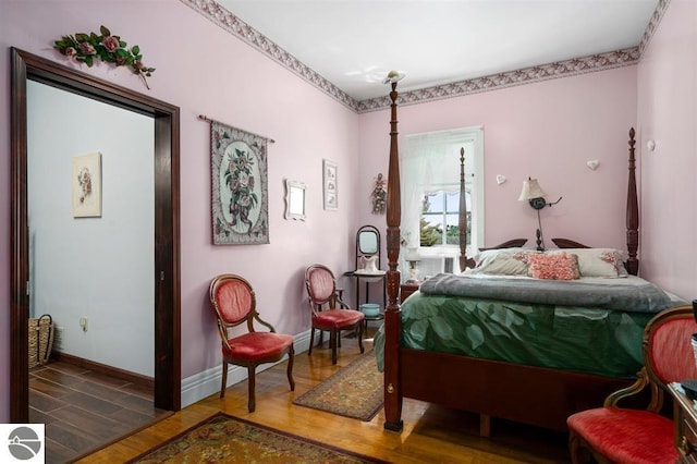 bedroom featuring dark hardwood / wood-style flooring