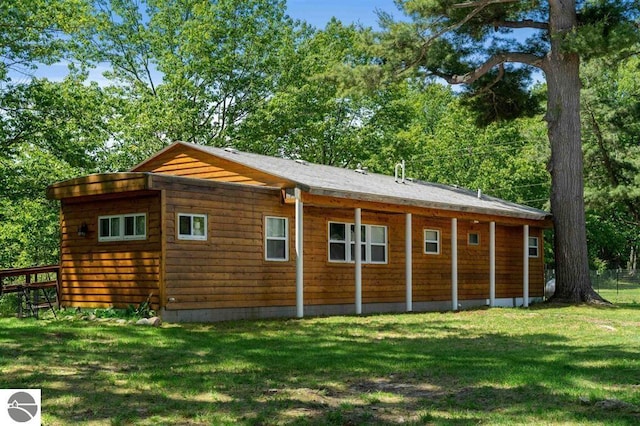 view of property exterior featuring a lawn