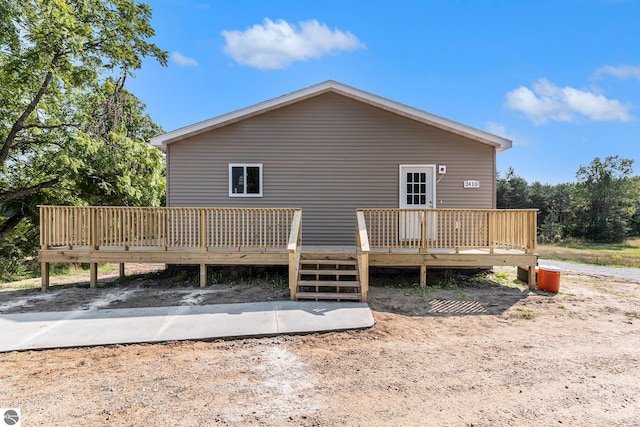 back of property featuring a wooden deck