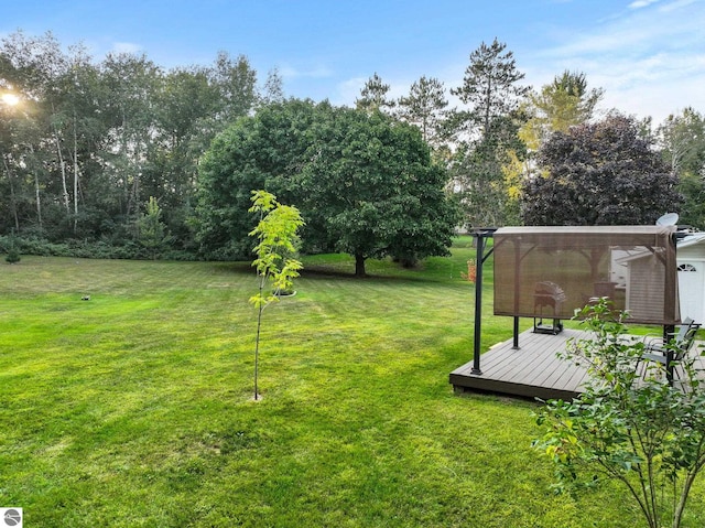 view of yard with a wooden deck