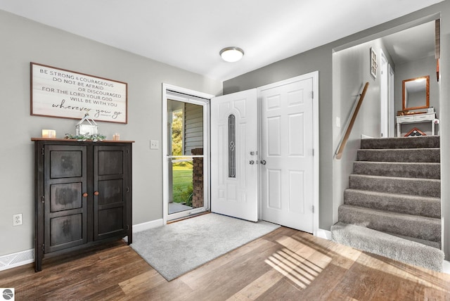 entryway with dark wood-type flooring