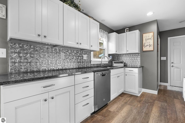 kitchen featuring dark wood-type flooring, sink, white cabinets, decorative backsplash, and stainless steel dishwasher