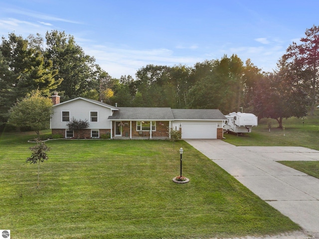 split level home with a front lawn and a garage