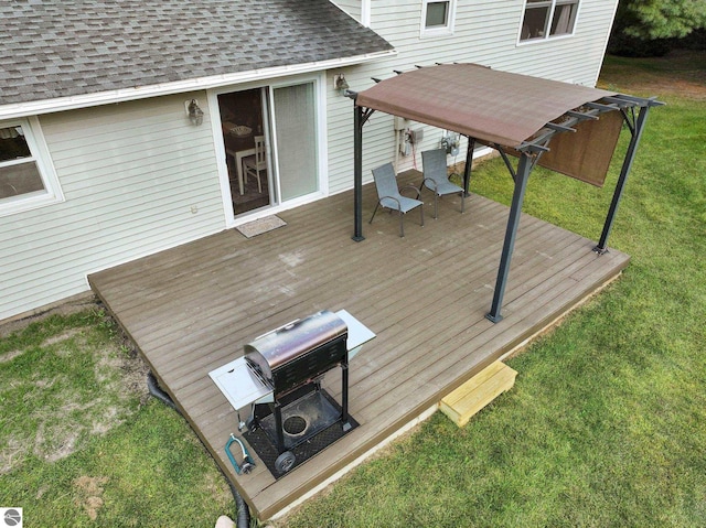 wooden terrace with a lawn