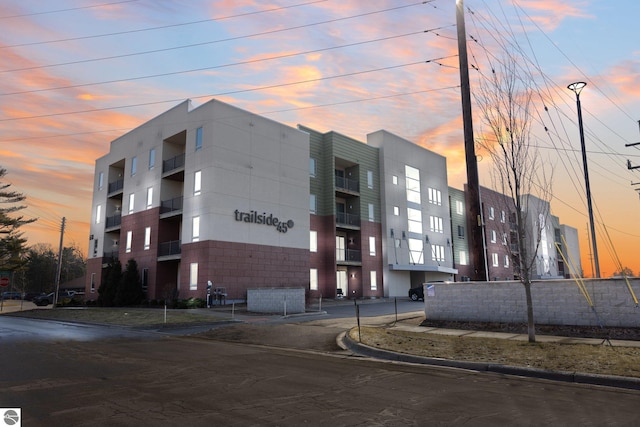 view of outdoor building at dusk