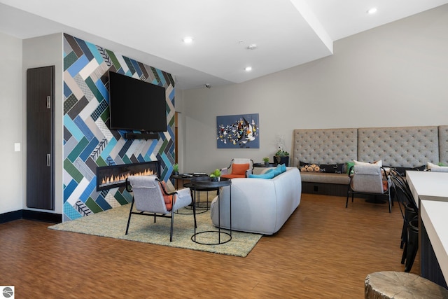 living room with hardwood / wood-style floors and a fireplace