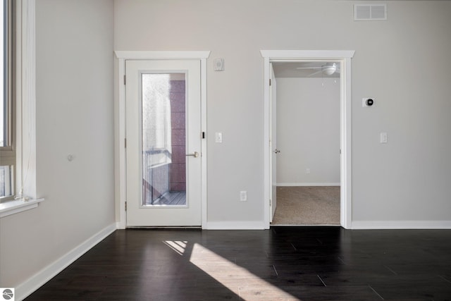 spare room with ceiling fan and dark hardwood / wood-style flooring