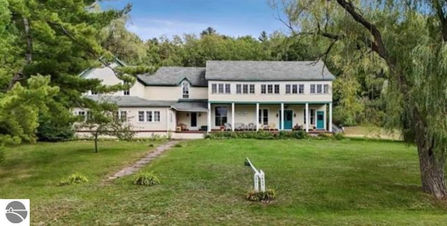 view of front of house featuring a front yard and a porch