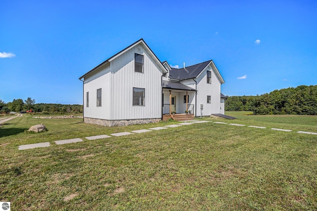 modern farmhouse with a front lawn