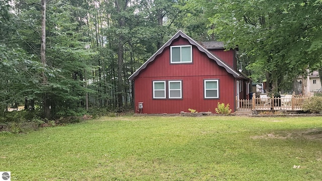 view of outbuilding with a yard