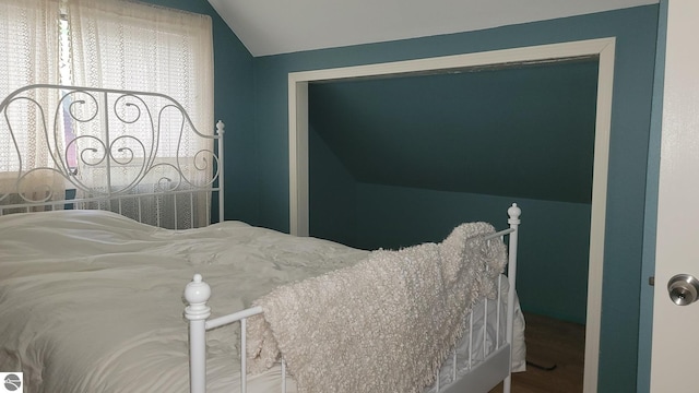 bedroom featuring vaulted ceiling