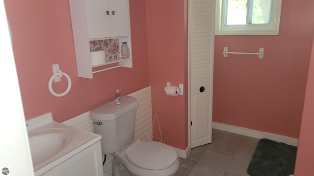 bathroom featuring vanity, toilet, and tile patterned floors