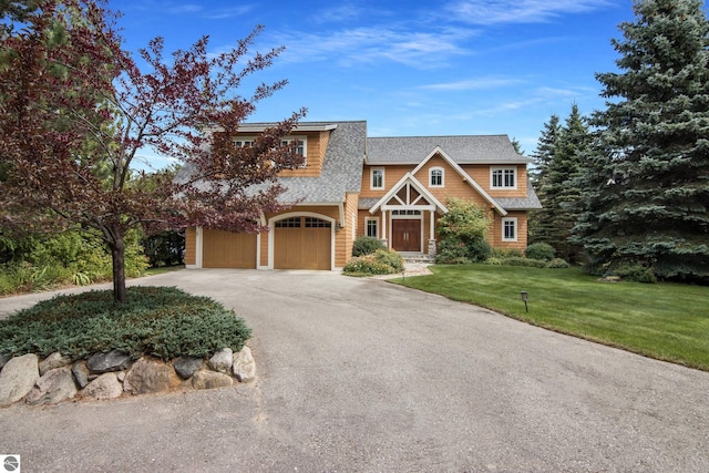 view of front facade featuring a garage and a front yard