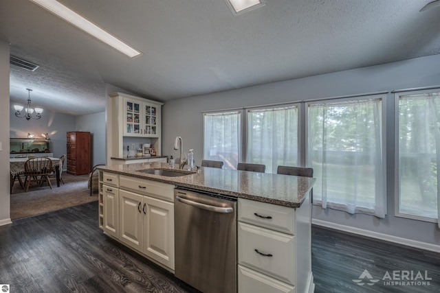 kitchen featuring dishwasher, an inviting chandelier, dark hardwood / wood-style flooring, sink, and a center island with sink