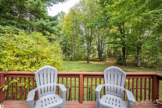 wooden terrace with a yard