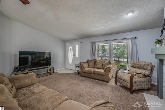 carpeted living room with a textured ceiling