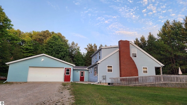 view of front of home with a front yard and a deck