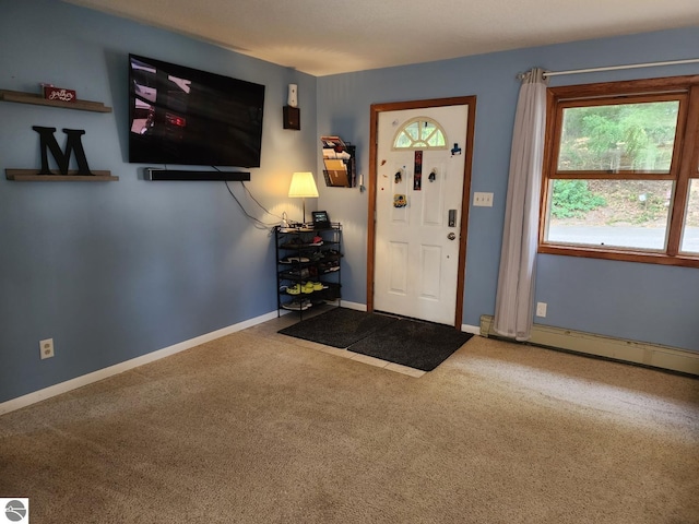 foyer featuring carpet