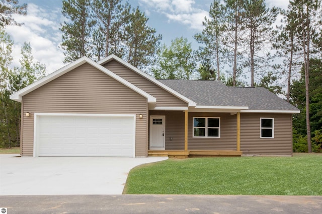 single story home featuring a garage and a front yard