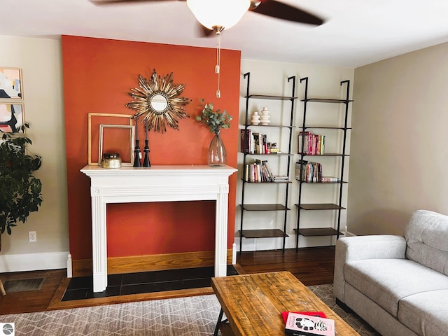 interior space with dark wood-type flooring and ceiling fan