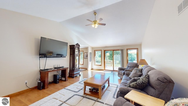 living room with light wood-type flooring, lofted ceiling, and ceiling fan