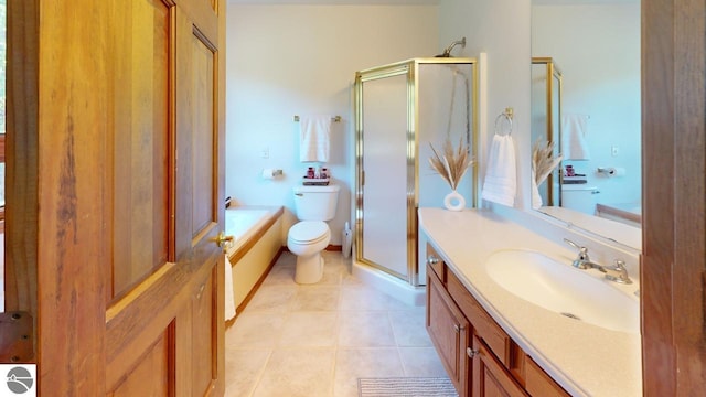 full bathroom with vanity, shower with separate bathtub, toilet, and tile patterned floors