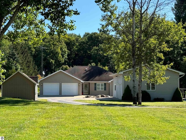 single story home with a front yard and a garage