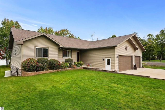 single story home featuring ac unit, a garage, and a front lawn