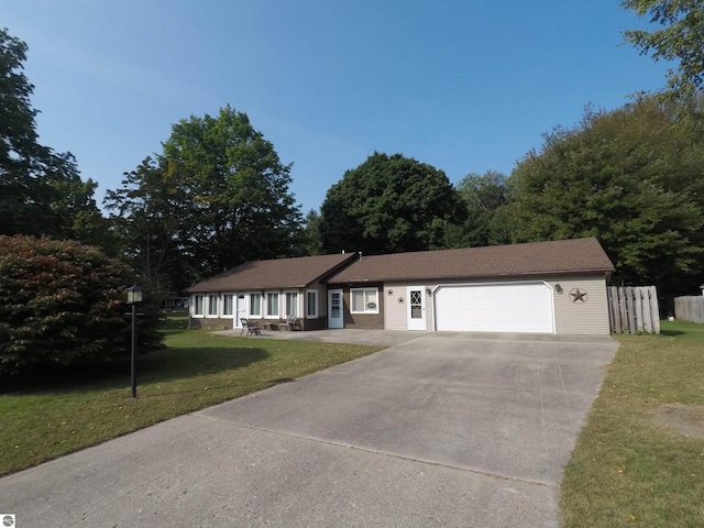 ranch-style house with a front yard and a garage