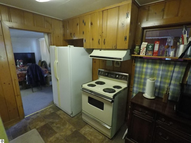 kitchen with wood walls and white appliances