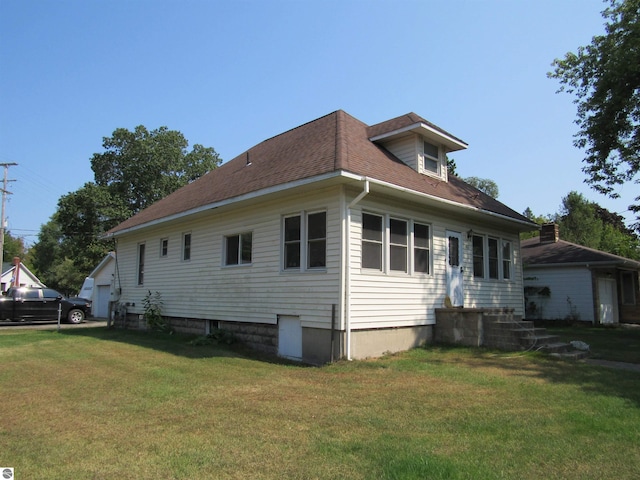 view of property exterior with a lawn