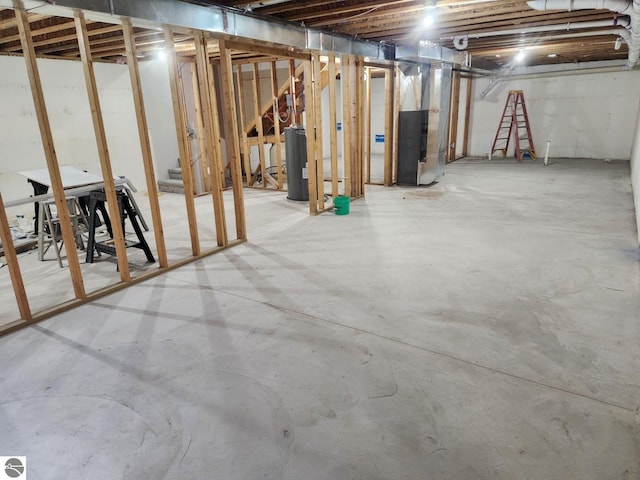 basement with gas water heater and heating unit