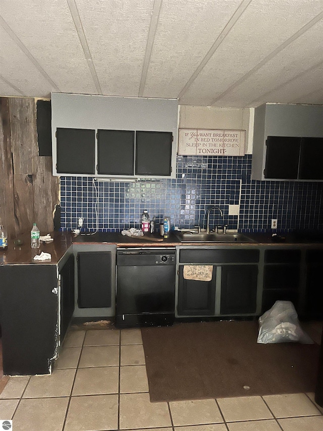 kitchen with dishwasher, sink, tasteful backsplash, and light tile patterned flooring