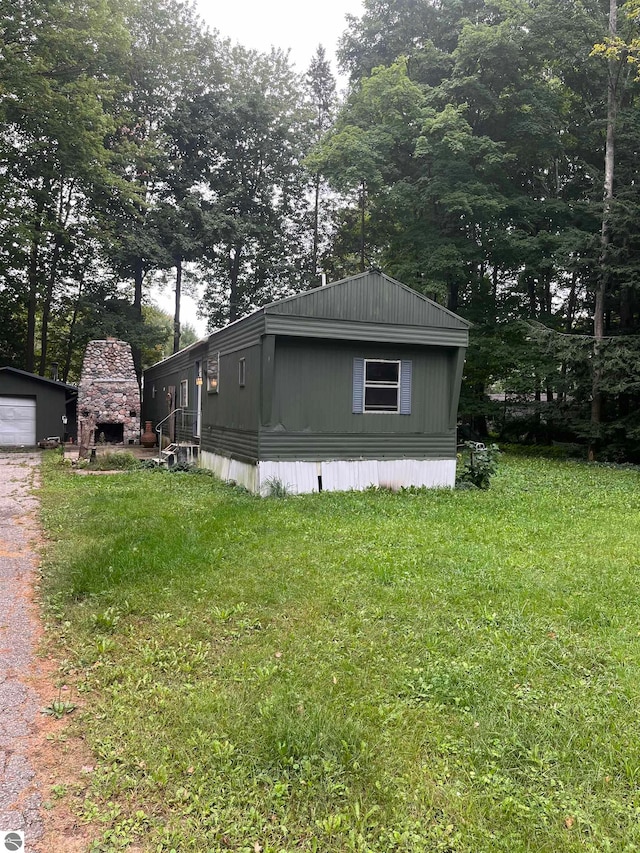 view of outbuilding with a lawn