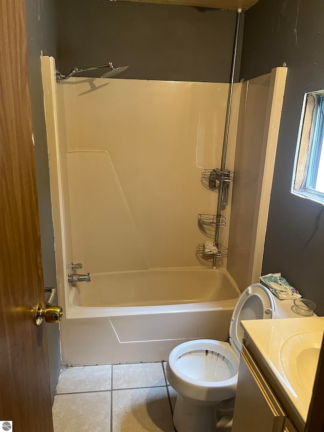 full bathroom featuring tile patterned floors, vanity, toilet, and  shower combination