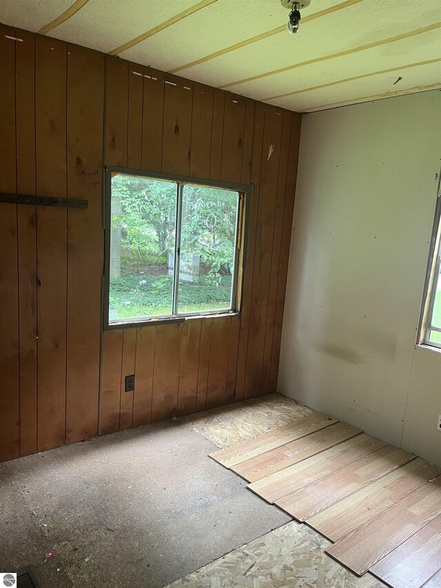 empty room with wood walls