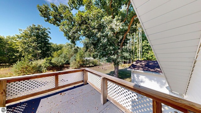 unfurnished room with a baseboard radiator, ceiling fan, light hardwood / wood-style flooring, and plenty of natural light