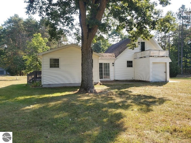 exterior space featuring a garage and a front lawn