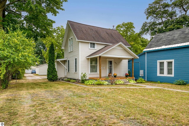 view of front of property featuring a front yard and a porch