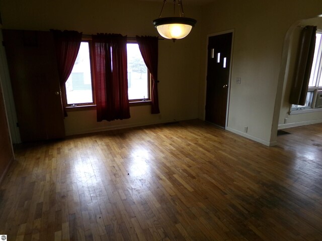 spare room featuring dark hardwood / wood-style flooring