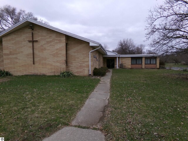 view of home's exterior with a yard