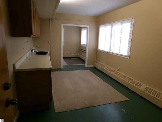 kitchen with a baseboard radiator and sink