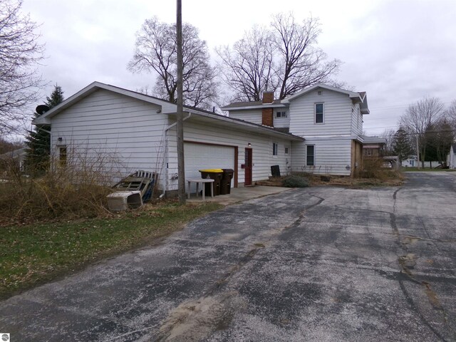 view of side of property featuring a garage