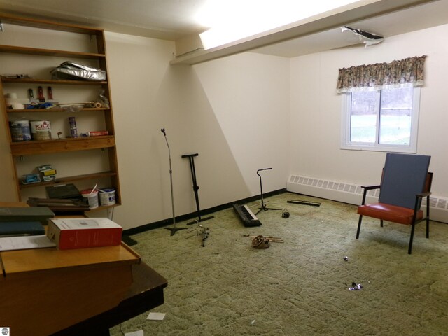 sitting room with radiator and carpet floors